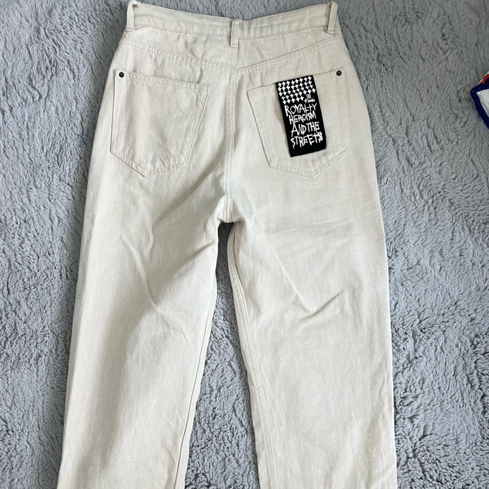 Royalty heroism and the streets cream color jeans